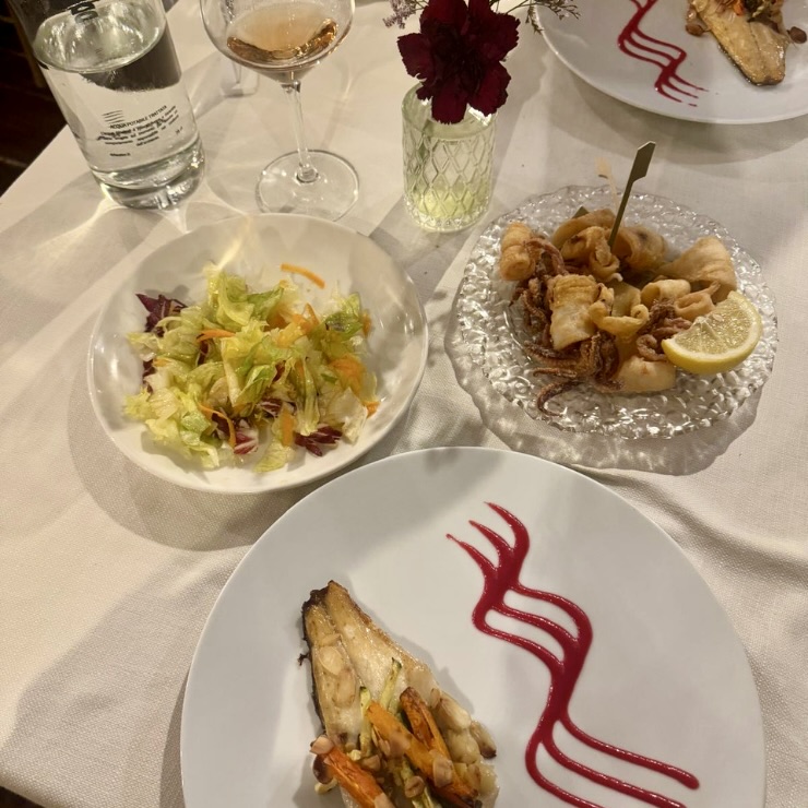 Grilled fish fried calamari and fresh salad second course at Trabocco Punta Cavalluccio Abruzzo Italy