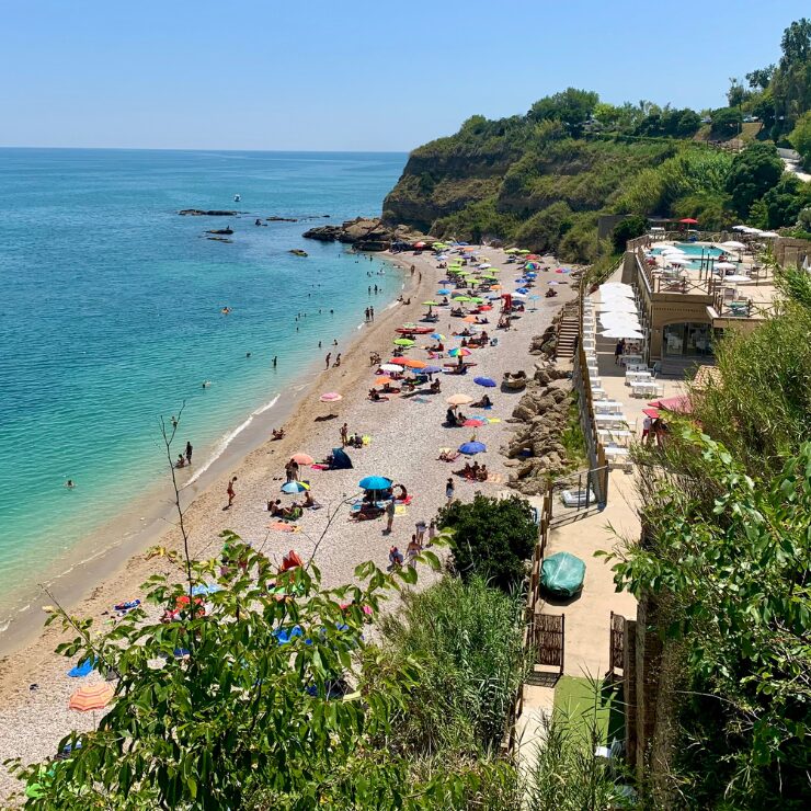 Ripari di Giobbe beach Ortona Abruzzo Italy with turquoise Adriatic water and colourful umbrellas Costa dei Trabocchi