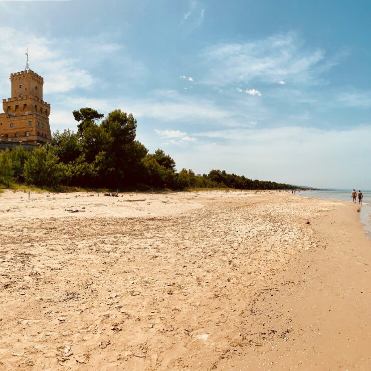 Torre di Cerrano beach Abruzzo Italy with golden sand and ancient watchtower