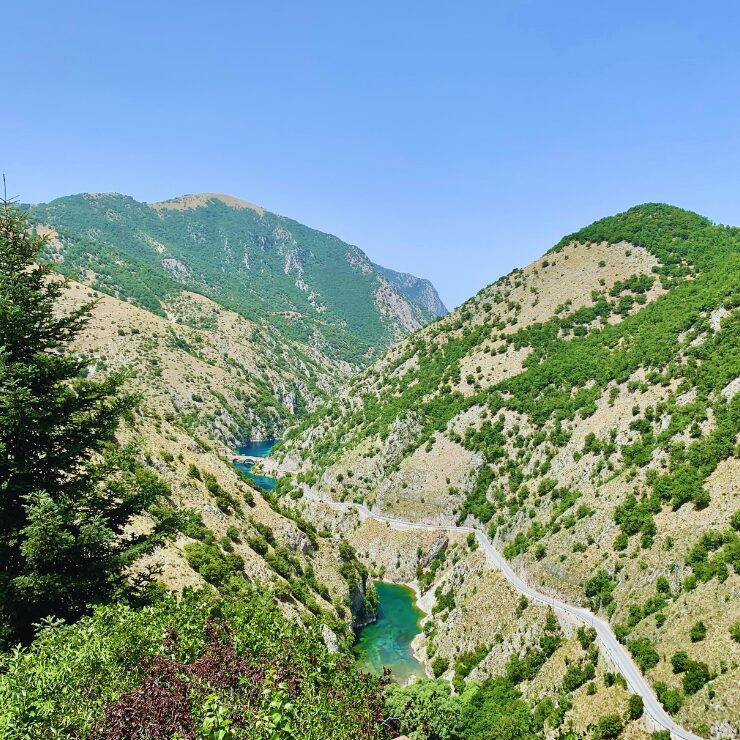 Panoramic view from Villalago Abruzzo Italy with turquoise river canyon and mountain landscape